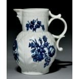 A Worcester cabbage leaf-moulded mask jug, c1770, transfer printed in underglaze blue with the