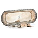 A pair of George III gadrooned silver wick trimmers and tray, crested, tray 27cm l, fully marked, by