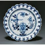 A Liverpool scalloped small plate, James Pennington, c1770, painted in underglaze blue with the Bird