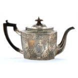 A George III silver teapot, octagonal, the domed oval lid with integral hinge, engraved in neo