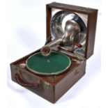 A Decca portable gramophone, with nickel plated reflector and maker’s sound box, in fabric covered