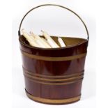 A Dutch brass bound mahogany bucket, second quarter 19th century, with a sheet brass half-depth