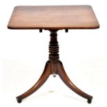 A George IV mahogany tripod table, early 19th c, the oblong top with rounded corners on ring