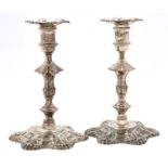 A pair of George III cast silver candlesticks, with shells, knopped stem and beaded rims, 19cm h,