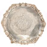 A George II silver salver, the moulded border with shells at intervals, on four hoof feet,