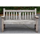 A timber garden bench, circa mid 20th c, seat height 41cm, 150cm l Old weathering and shrinkage