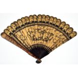 A Chinese black and gold export lacquer fan, early 19th c, decorated to either side with a