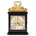 An English basket top ebony clock, Nicholas Massy, dated 1686, the 17cm brass dial with matted