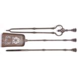 A set of three English burnished steel fire irons, first half 19th century, shovel 70cm long