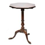 A George III mahogany tripod table, c1780, with octagonal top, baluster knop and pointed feet,