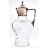 An Edward VII silver mounted cut glass claret jug, of inverted baluster shape with angular handle,