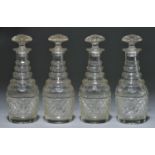 A set of four miniature cut glass Prussian decanters and stoppers, early 19th c, with four faceted