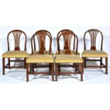 A set of six George III mahogany hoop back dining chairs, c1800, with close nailed stuffed over seat
