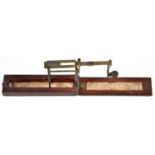 A brass and mahogany folding coin scale or Lancashire gold balance, early 19th c, with printed paper