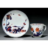 A Vauxhall coffee cup and saucer, c1760, decorated in Imari style with a bird, hollow rock and