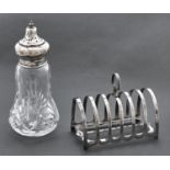 A George V silver seven hoop toast rack, 11.5cm l, by James Deakin & Sons, Sheffield 1929 and a