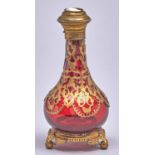A Palais Royal giltmetal mounted ruby glass scent bottle, c1870, the cap inset with cameo of the