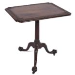 A mahogany tripod table, early 20th c, the oblong top with re-entrant corners and foliate carved