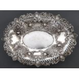 A Victorian silver pierced oval fruit dish, die stamped with flowers and scrolls, 30cm l, by Ellis &