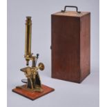 A brass bar limb compound microscope, late 19th c,  the limb on trunnions supported by black
