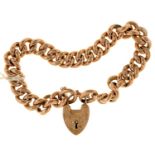 A gold curb bracelet and padlock, early 20th c, 21cm, marked 9c, 21g Wear consistent with age