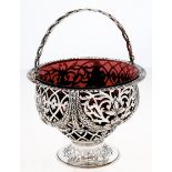 An Edwardian pierced and die stamped ogee silver sugar basket, decorated with festoons, pierced