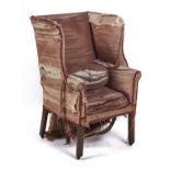 A George III wing back armchair, 18th c, on plain square walnut legs, with two cushions, seat height