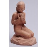 A French terracotta sculpture of a semi naked maiden tenderly holding a bird, cast from a model by R