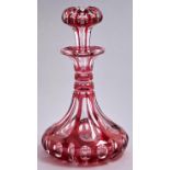A cranberry-cased clear glass scent bottle and stopper, late 19th c, 17cm h Good condition