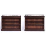 A pair of Edwardian mahogany open bookcases, the rectangular top with three quarter spindle