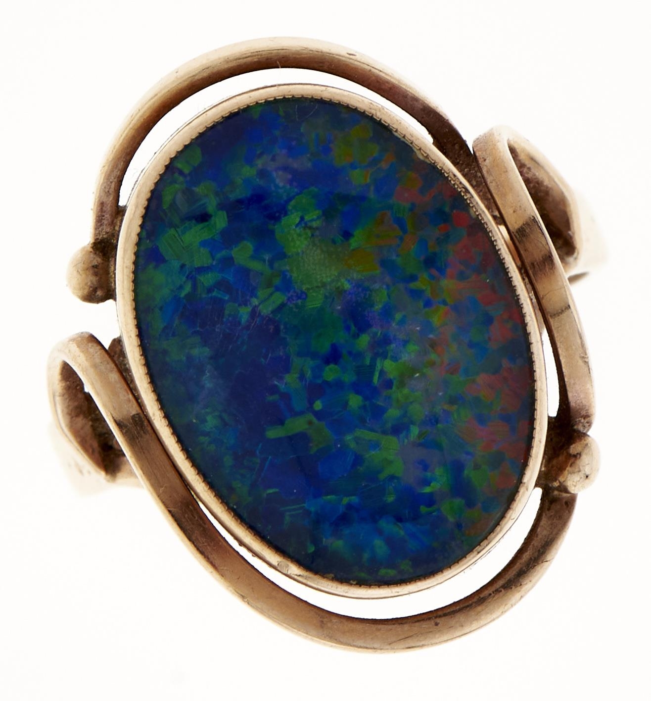 A synthetic opal doublet ring, in gold, marked 9ct, 5.3g, size N Good condition