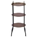 A French three tier serpentine walnut, marquetry, ebonised and giltmetal mounted etagere, late