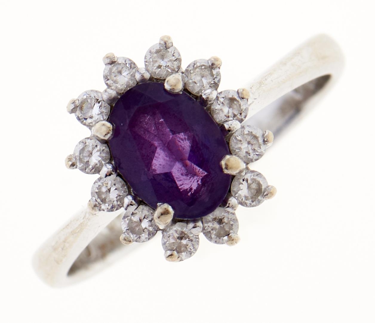 An amethyst and white stone cluster ring, in white gold, marked 14K, 3.1g, size K Good condition