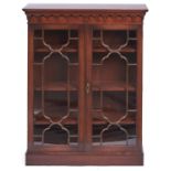 A mahogany bookcase, 20th c, in George III style, with pear drop frieze, fitted with adjustable