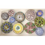 Eleven millefiori paperweights, late 20th c, including spaced and concentric, various