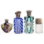 Two Victorian silver mounted blue or green cased and cut glass scent bottles, a silver capped