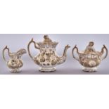 A Rockingham teapot and cover, sucrier and cover and cream jug, c1838-42, of single spur handle