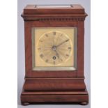 A Victorian mahogany mantel timepiece, c1840, with engine turned square gilt brass dial and steel