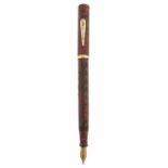 A Waterman sealing wax red fountain pen, Ideal, the gold nib marked 14 585 Good condition for age,