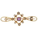 An amethyst and split pearl openwork brooch, early 20th c, in gold, marked 15, 3.2g Good condition