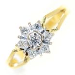 A diamond cluster ring, the gold hoop with pierced shoulders, marked 18ct, 3.2g, size J Good