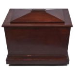 A Victorian mahogany wine cooler, mid 19th c, of sarcophagus shape on stepped plinth and castors,