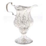A George III silver pear shaped cream jug, chased with flowers, 11.5cm h, by Thomas Shepherd, London