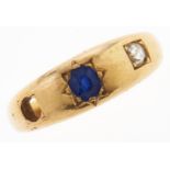 A sapphire and diamond ring, c1900, gipsy set, in gold, marked 18ct, 6.1g, size S One stone