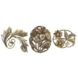 An American silver two flower brooch, 45mm, marked STERLING, a Mexican silver triple leaf brooch and