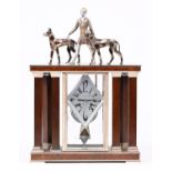 A French art deco patinated and chromium plated metal architectural mantel clock, A la Renaissance