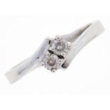 A diamond crossover ring, in white gold, marked 750, 3.2g, size L Good condition