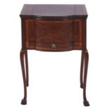 An Edwardian bow centred mahogany and crossbanded wax table, on cabriole legs, lined in watered blue