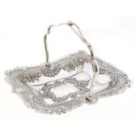 An Edwardian pierced and die stamped cake basket, with trellis border and crimped rim, wirework