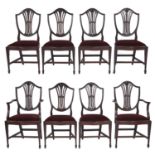 A set of eight mahogany dining chairs, early 20th c, the shield back with carved wheatear splat, the